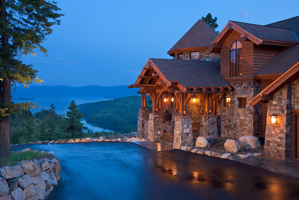 Inspiration for a timeless stone exterior home remodel in Other