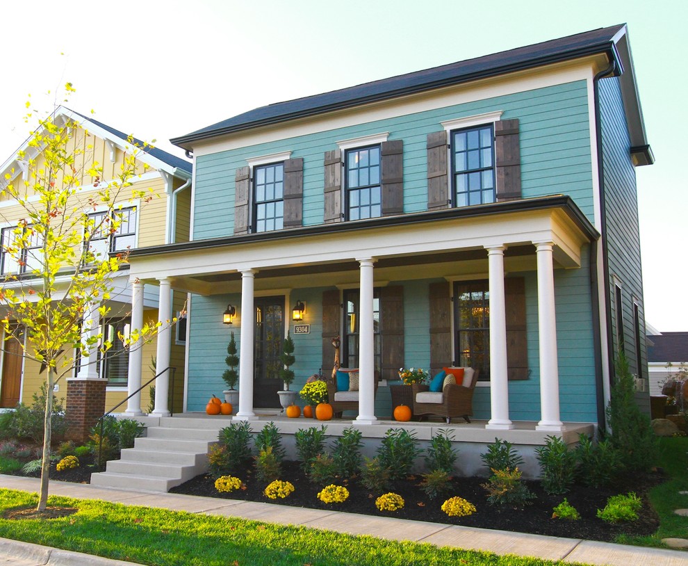 Medium sized and blue traditional two floor house exterior in Louisville.