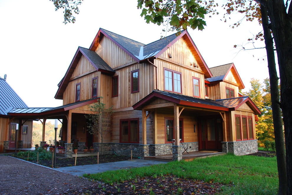 Example of a classic stone exterior home design in Burlington