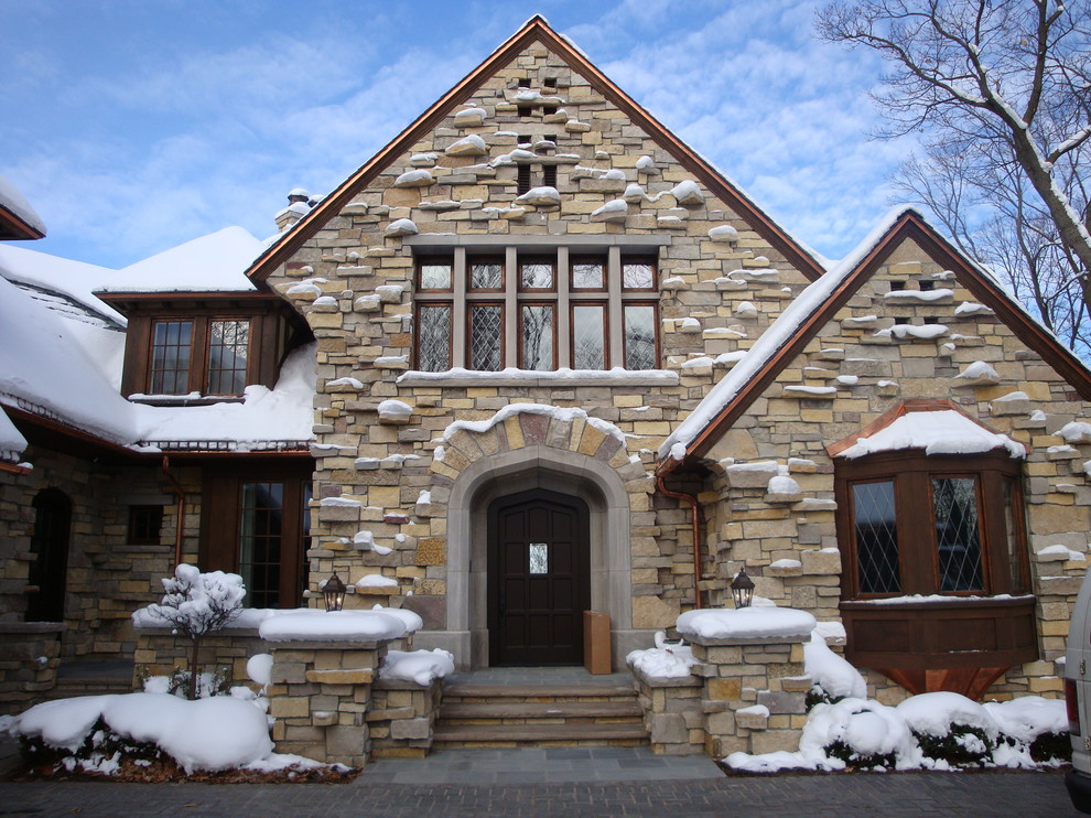 Inspiration for a timeless two-story stone exterior home remodel in Minneapolis