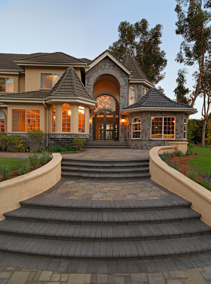 This is an example of a beige traditional house exterior in Orange County.
