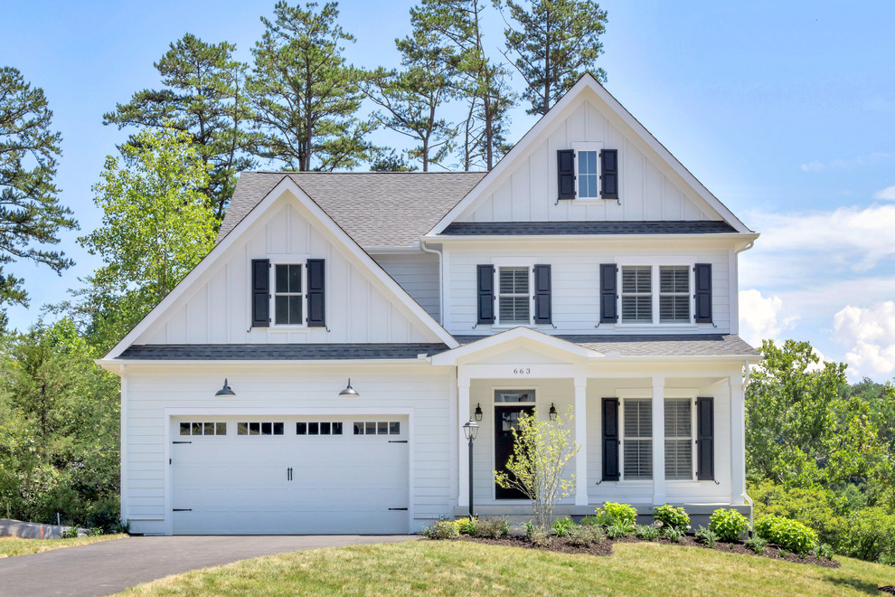Example of a mid-sized classic white two-story concrete fiberboard exterior home design in Other with a shingle roof