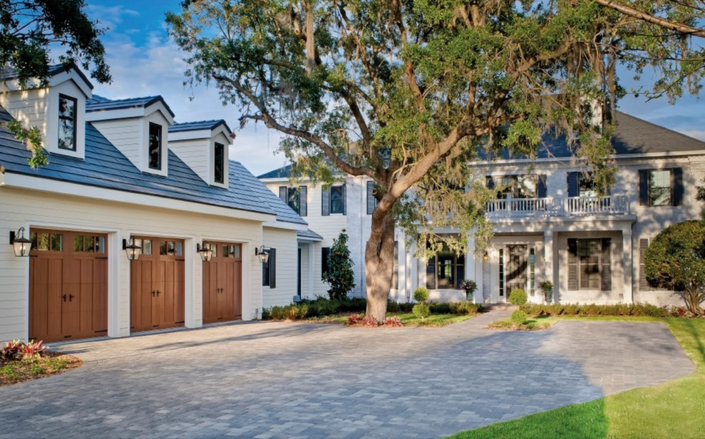 Example of a large classic white two-story house exterior design in Orange County with a hip roof and a shingle roof