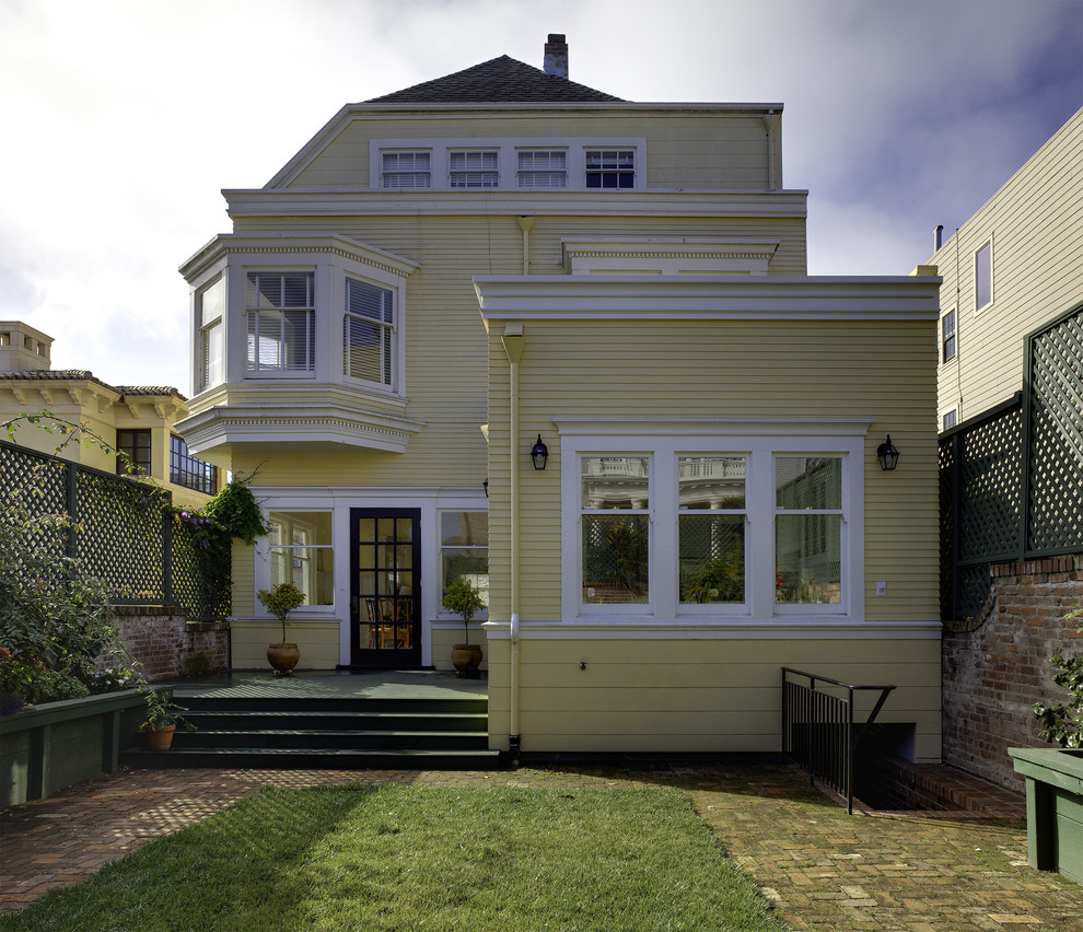 Inspiration for a mid-sized timeless three-story wood exterior home remodel in San Francisco