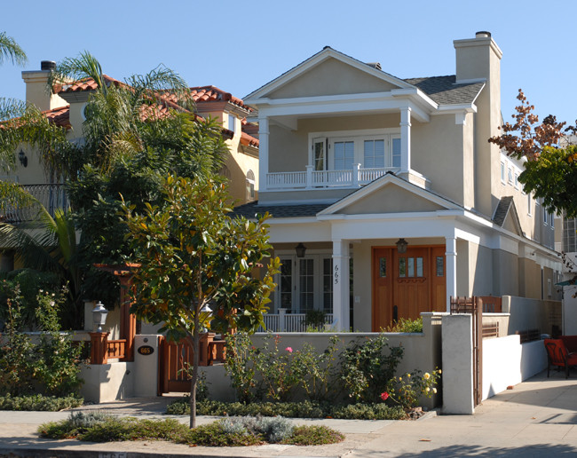 Inspiration for a large timeless two-story stucco exterior home remodel in San Diego