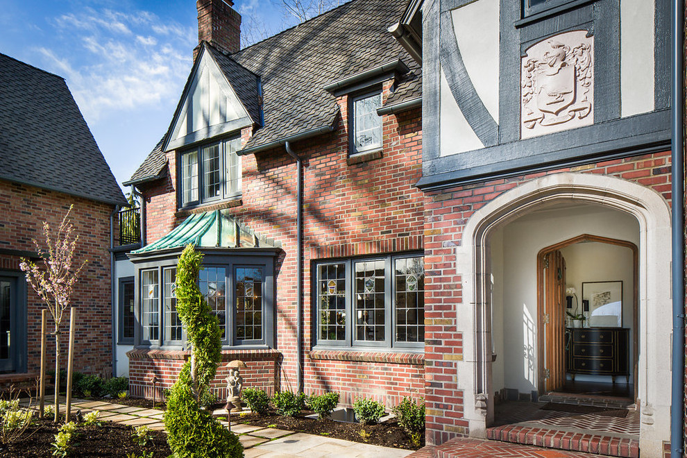 Inspiration for a large and red classic two floor brick detached house in Phoenix with a pitched roof.