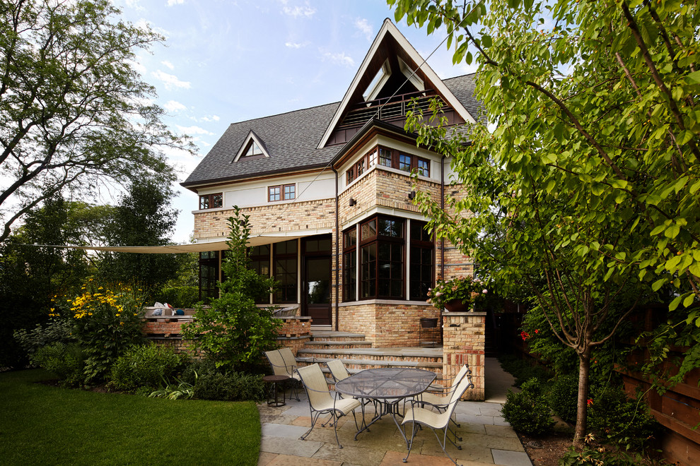 Example of a transitional three-story exterior home design in Chicago