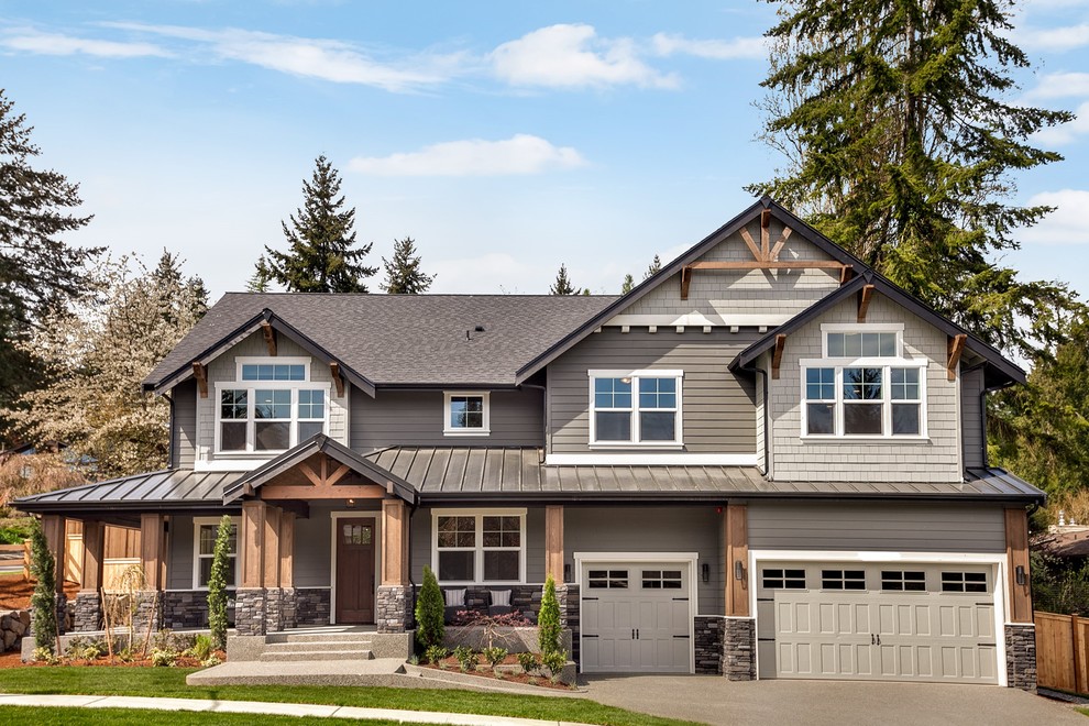 Inspiration for a transitional gray two-story exterior home remodel in Seattle with a shingle roof