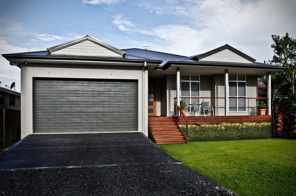 Example of a transitional one-story wood exterior home design in Sydney