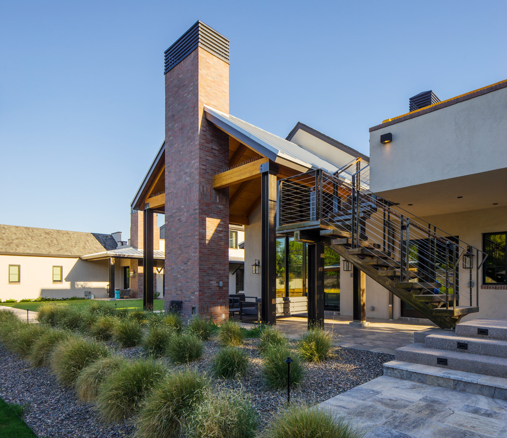 Design ideas for a farmhouse house exterior in Phoenix.