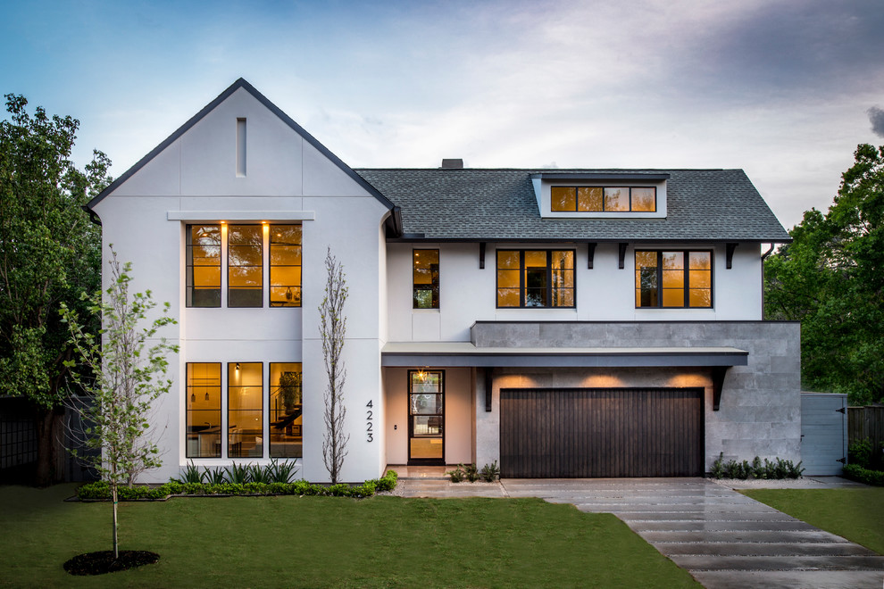 Large transitional white two-story stucco exterior home idea in Houston with a shingle roof
