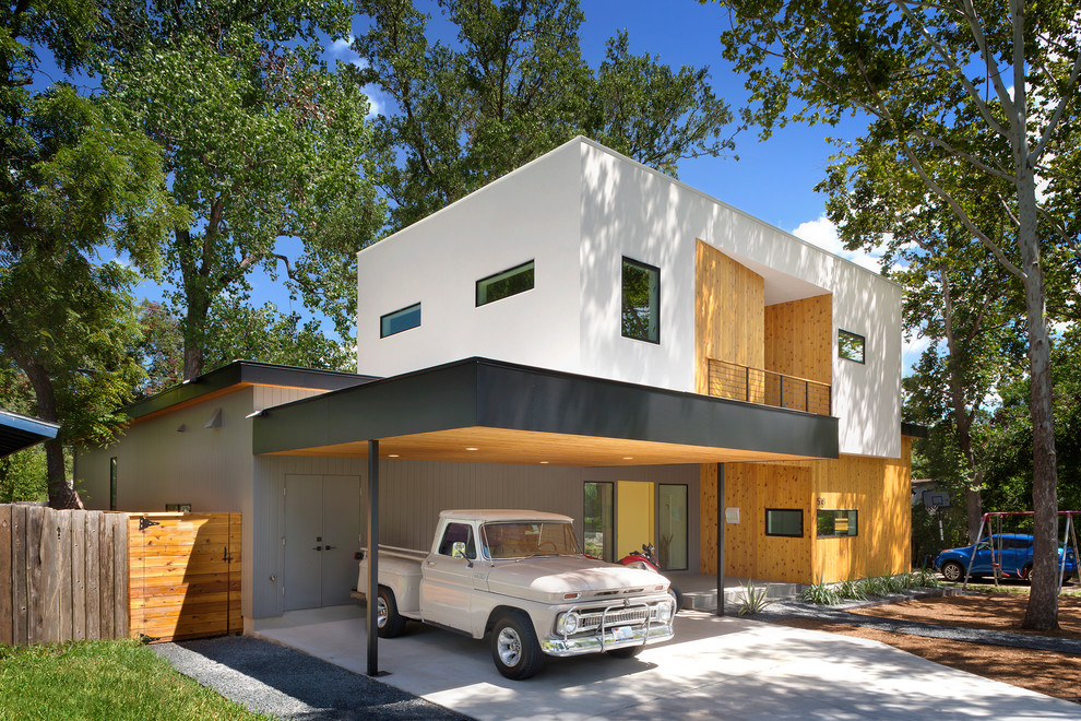 Стильный дизайн: двухэтажный дом среднего размера в стиле модернизм с плоской крышей - последний тренд