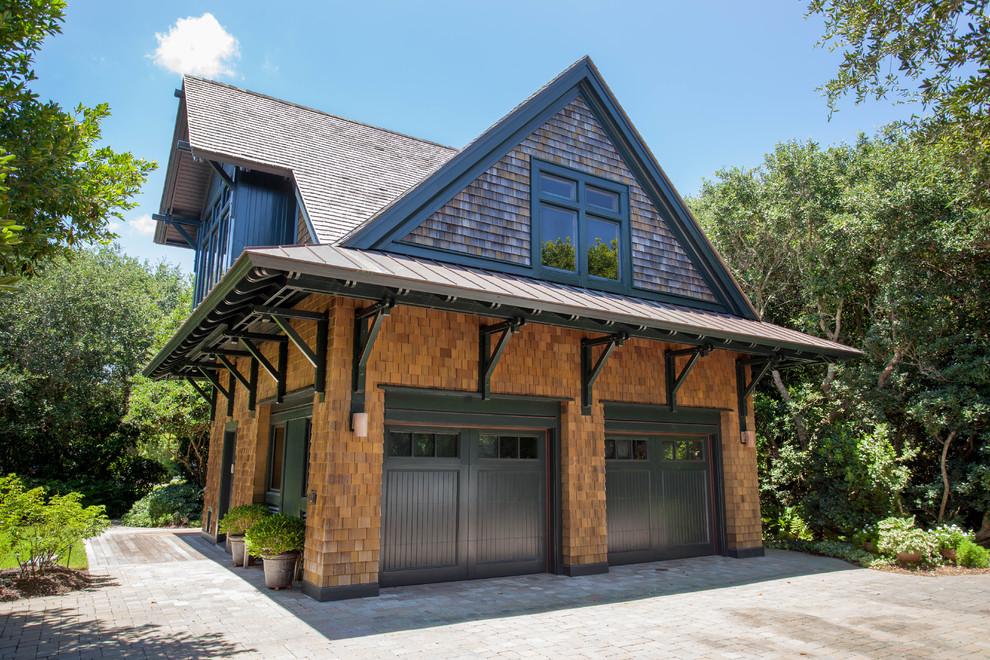 Example of a mid-sized arts and crafts brown two-story wood exterior home design in Wilmington with a shingle roof