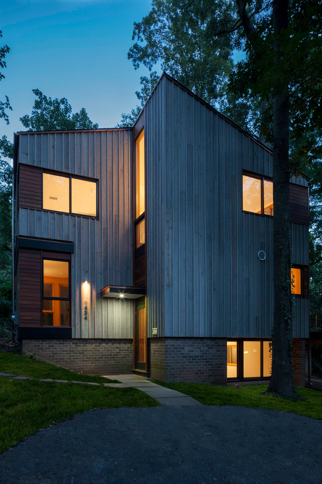 Example of a trendy wood exterior home design in DC Metro