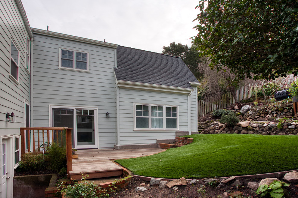 Mid-sized traditional green two-story concrete fiberboard exterior home idea in San Francisco with a shingle roof