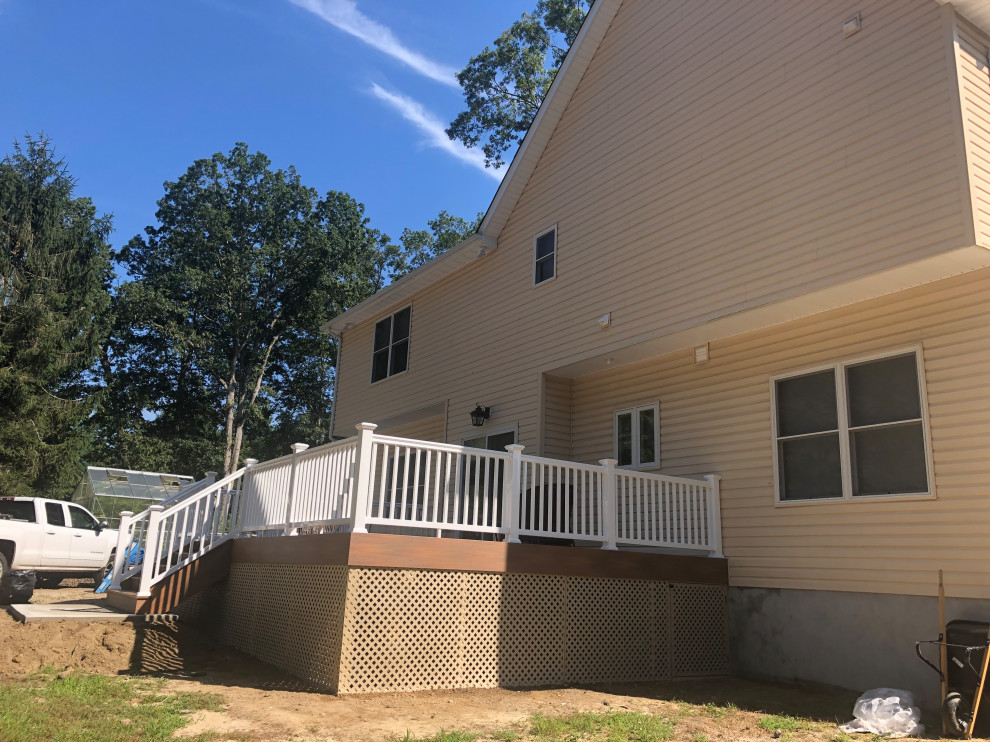 Trex Deck and Concrete Patio Modern House Exterior New York by