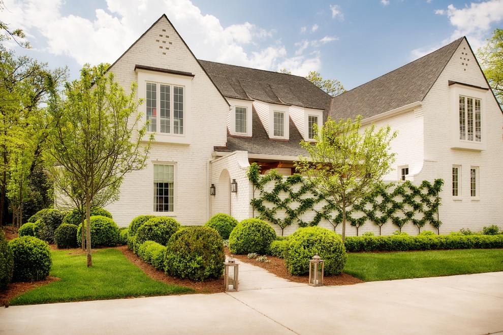 Design ideas for a white traditional brick house exterior in Nashville.