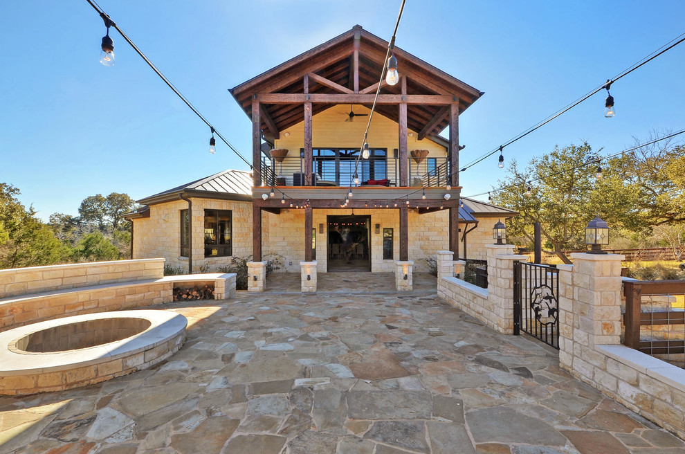 Huge mountain style two-story exterior home photo in Austin