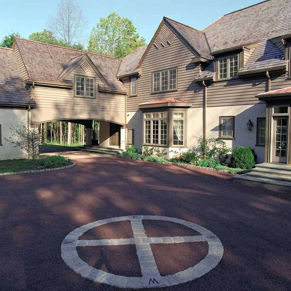 Large traditional beige three-story stucco exterior home idea in Philadelphia