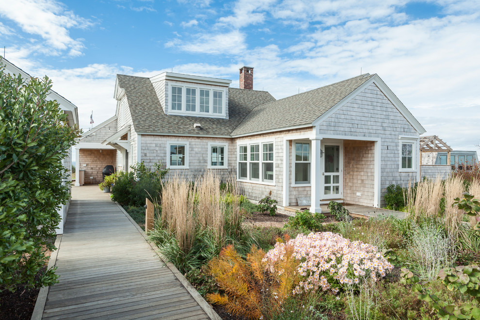 Inspiration for a coastal two-story wood gable roof remodel in Boston