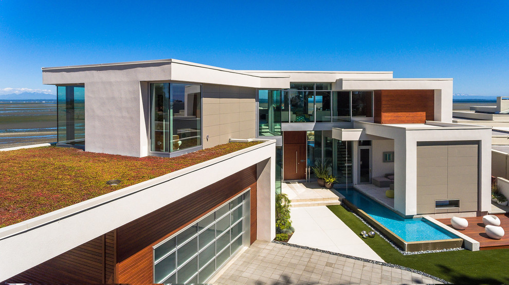 Großes, Zweistöckiges Modernes Einfamilienhaus mit Flachdach, Misch-Dachdeckung, Mix-Fassade und bunter Fassadenfarbe in Vancouver