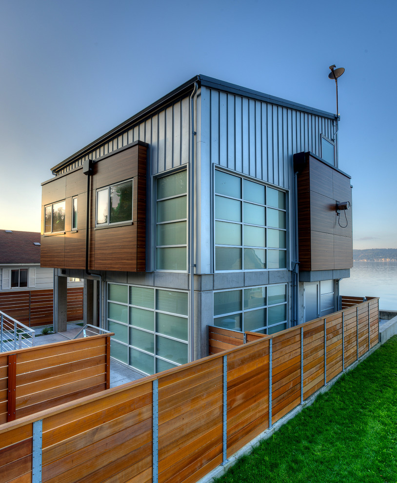 Photo of a gey contemporary two floor house exterior in Seattle.