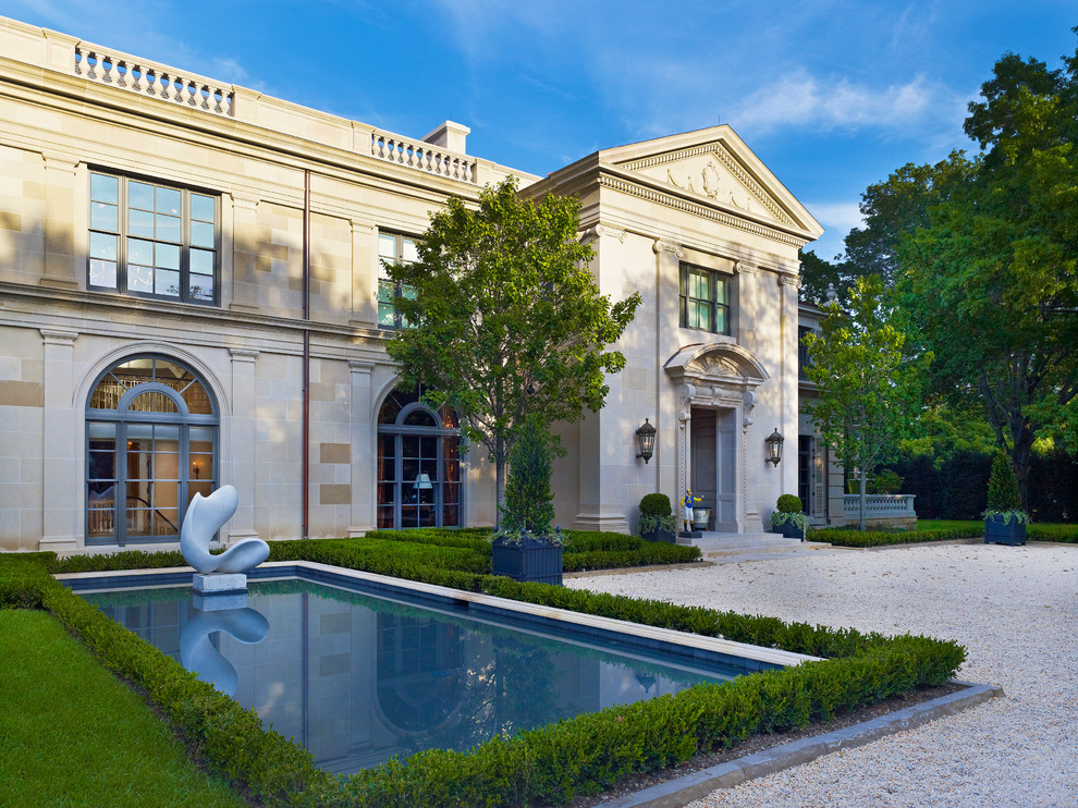 Huge elegant two-story stone exterior home photo in Dallas