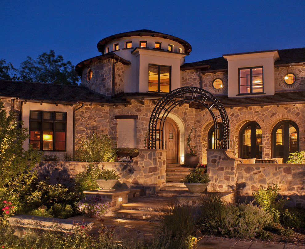 Photo of a mediterranean house exterior in Milwaukee with stone cladding.