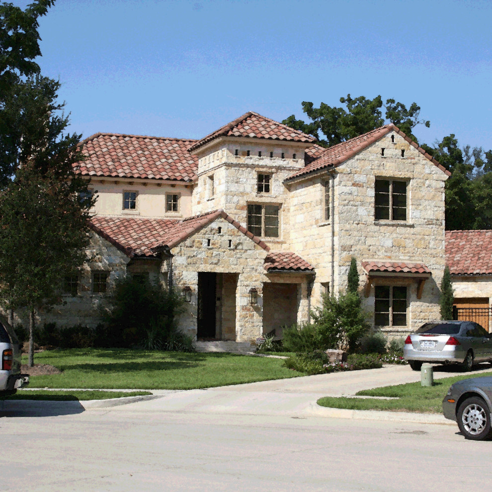 This is an example of a large mediterranean house exterior in Dallas.