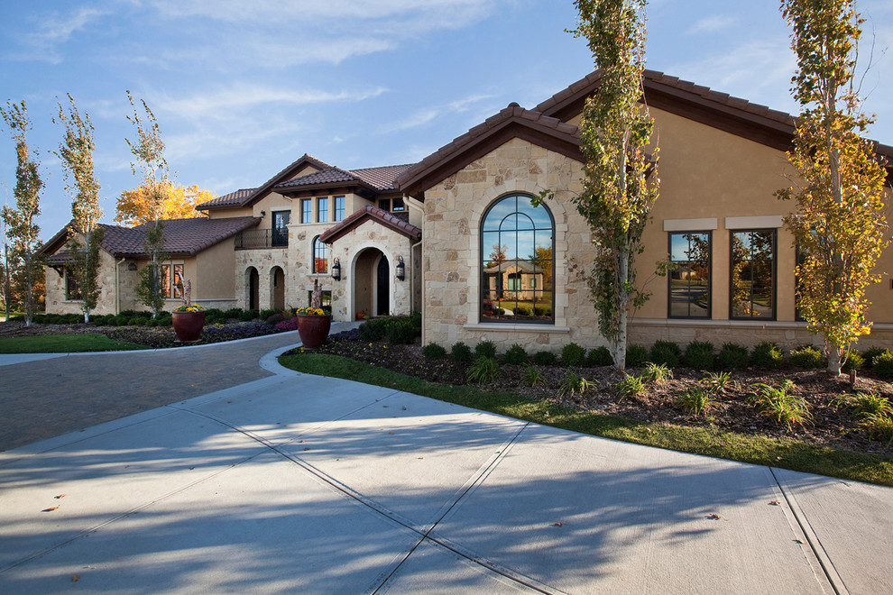 Example of a tuscan exterior home design in Omaha