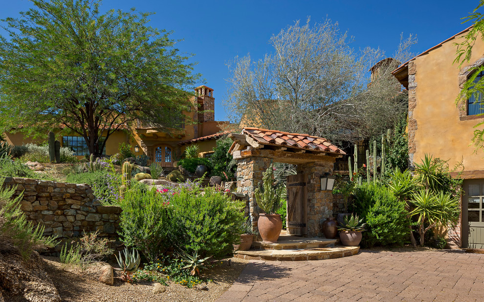 Tuscan yellow mixed siding exterior home photo in Phoenix
