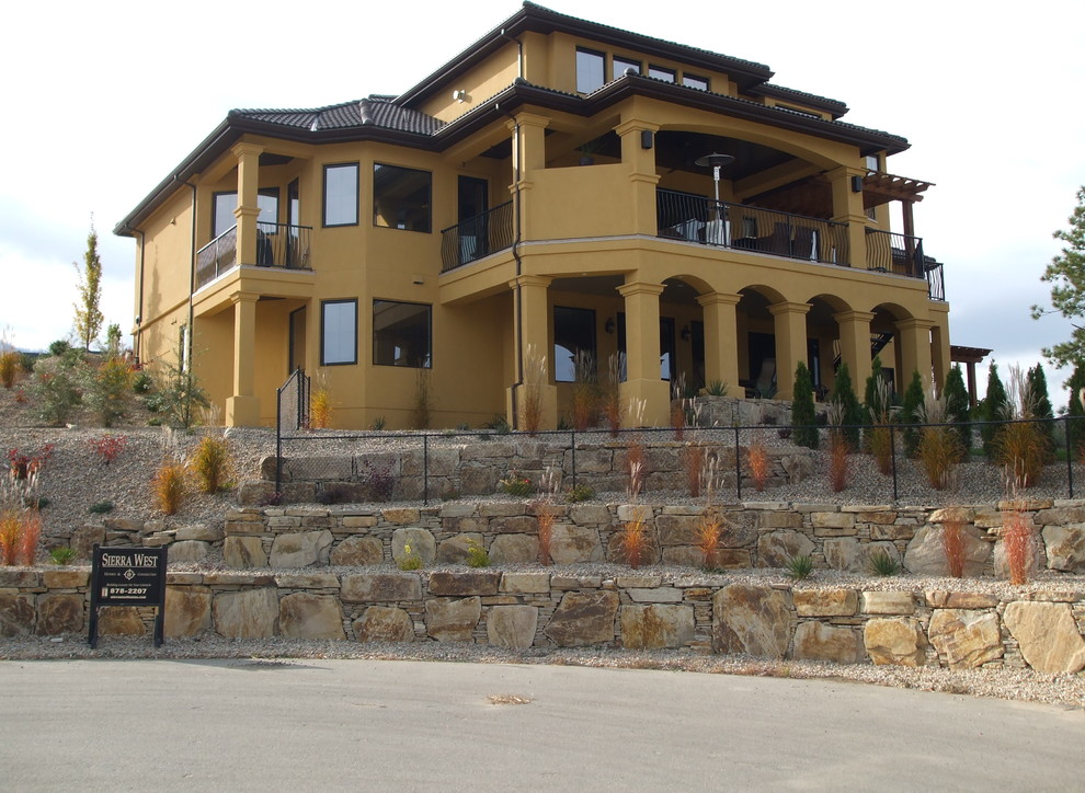 Example of a tuscan exterior home design in Vancouver
