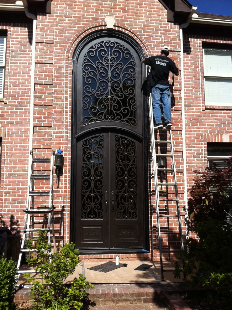 Example of a tuscan exterior home design in Other