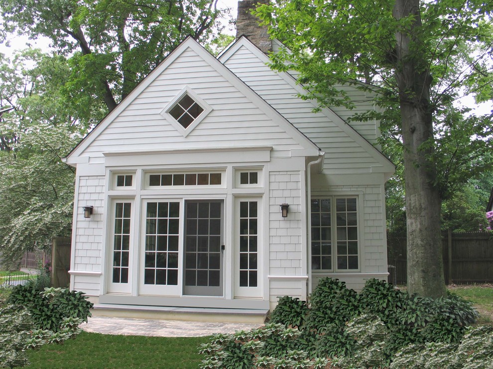Inspiration for a medium sized and white contemporary two floor house exterior in Portland Maine with wood cladding.