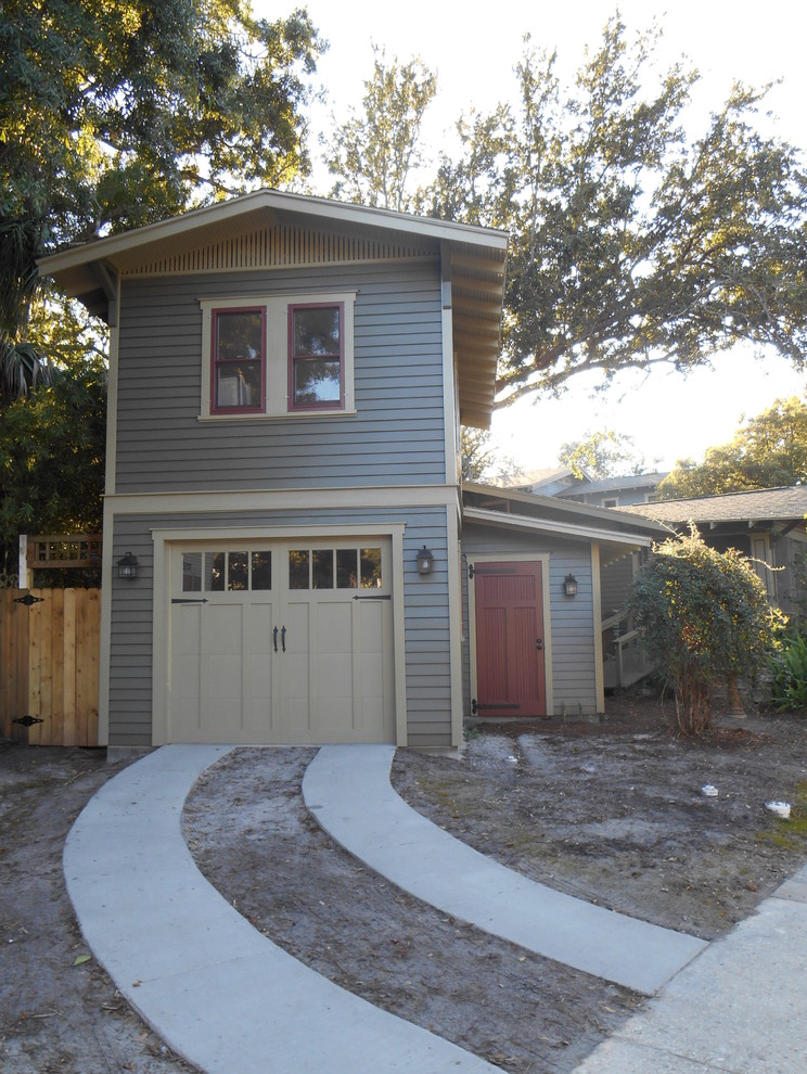 Example of a small classic gray two-story wood gable roof design in Tampa