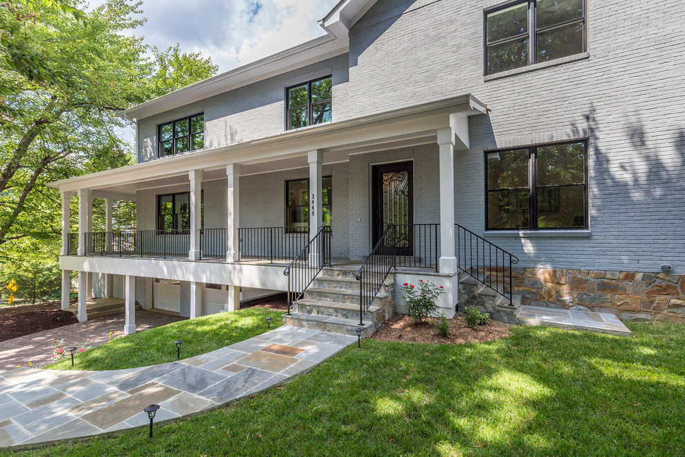 Large transitional gray three-story brick exterior home photo in DC Metro