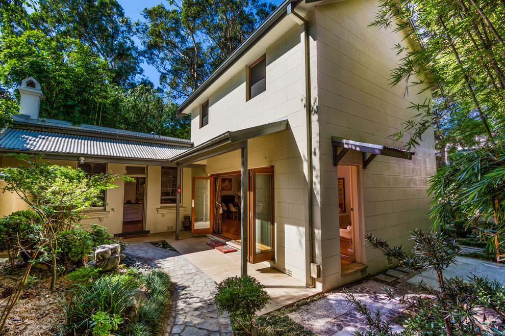 Transitional beige two-story concrete gable roof idea in Sydney