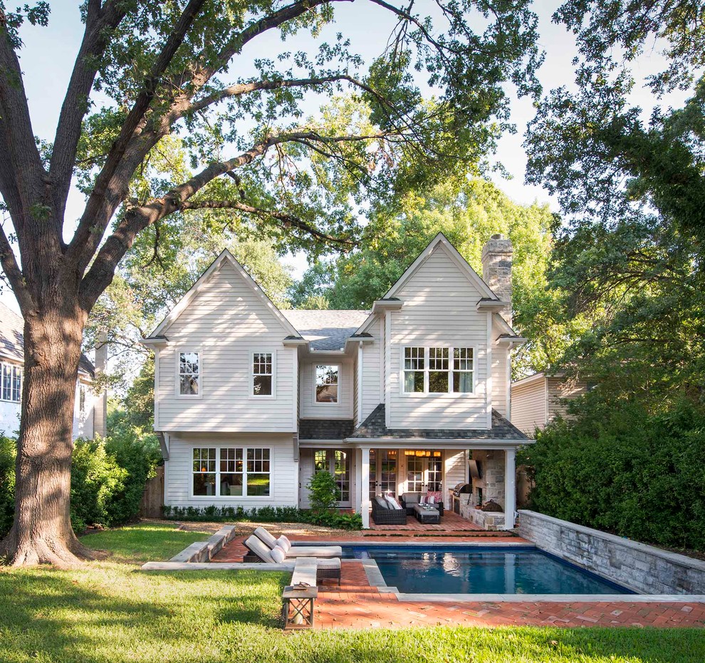 Inspiration for a timeless beige two-story gable roof remodel in Dallas