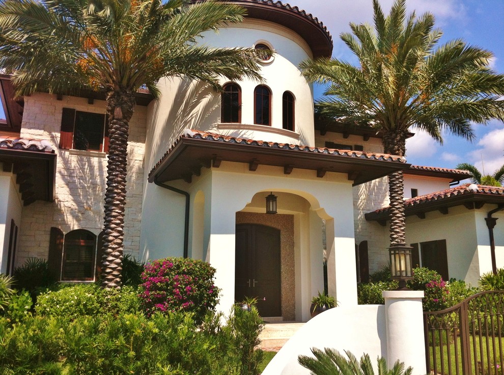 Design ideas for a mediterranean house exterior in Miami.