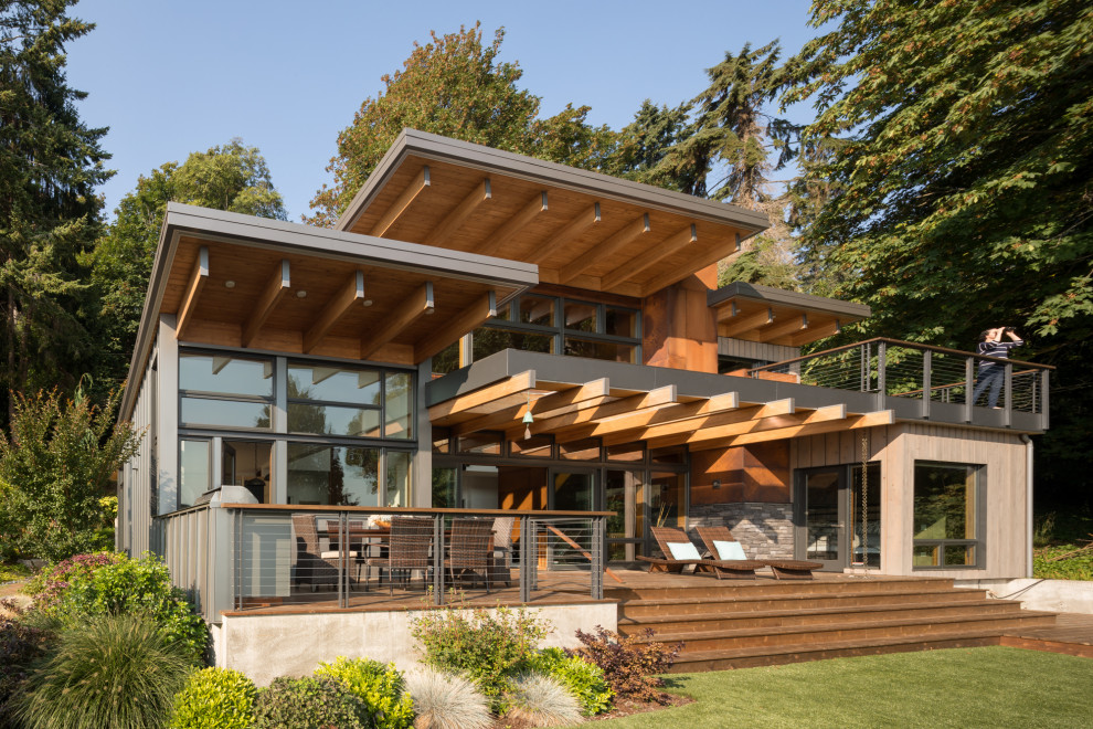 Example of a large minimalist brown two-story exterior home design in Seattle