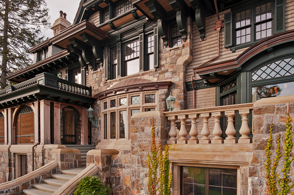 Inspiration for an expansive victorian house exterior in New York with three floors and stone cladding.