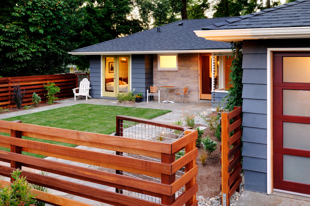 Example of a mid-sized trendy blue one-story wood exterior home design in Seattle