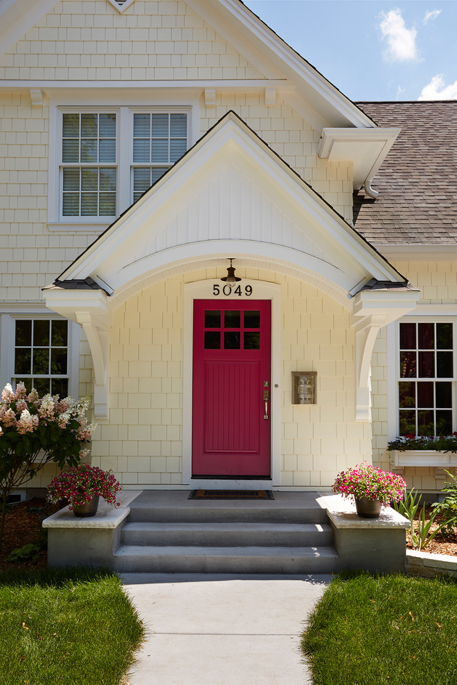 Mid-sized transitional yellow two-story wood gable roof idea in Minneapolis