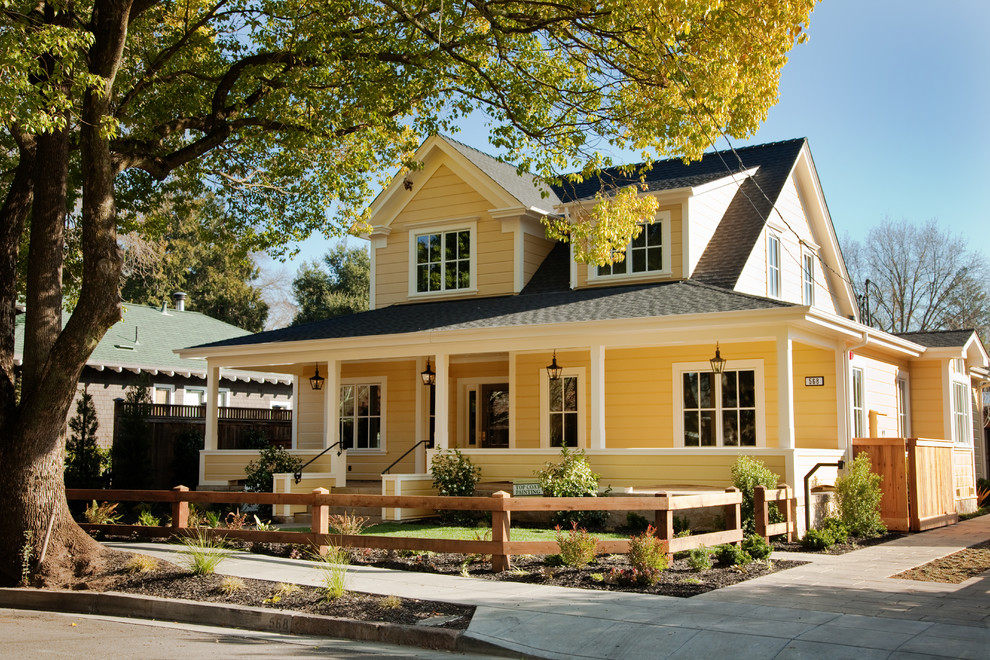 Mid-sized farmhouse yellow two-story gable roof idea in San Francisco
