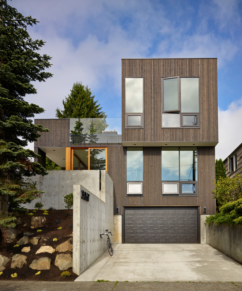 Idee per la facciata di una casa contemporanea con rivestimento in legno e tetto piano
