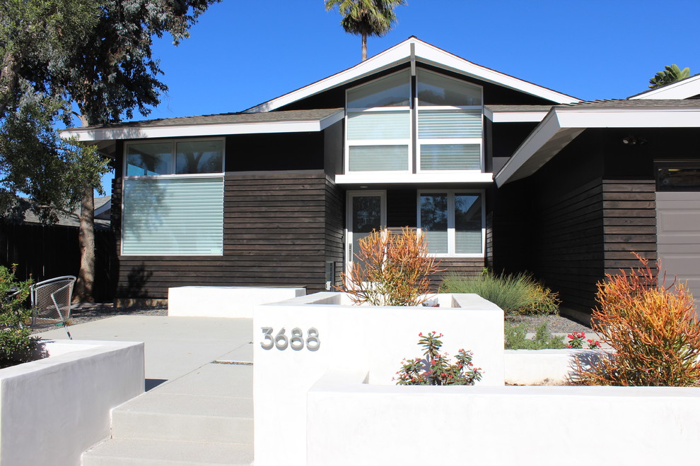 Mid-sized zen black two-story wood house exterior photo in San Diego with a shingle roof