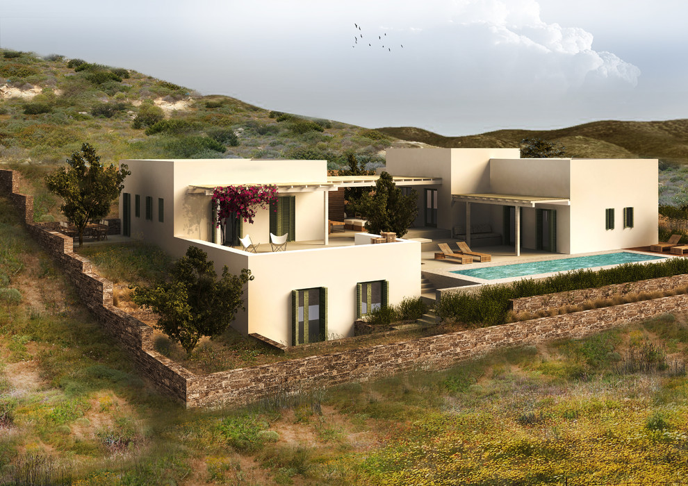 Aménagement d'une façade de maison blanche méditerranéenne avec un toit plat.