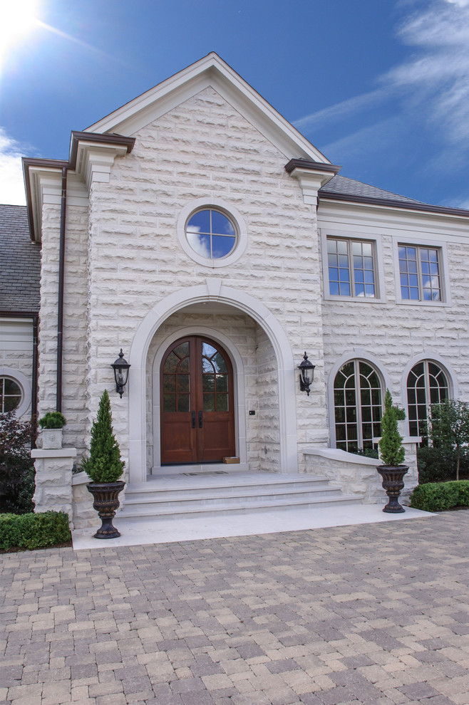 Elegant stone exterior home photo in Chicago