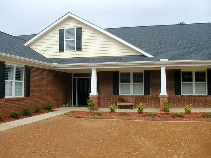 Beige classic brick detached house in Raleigh.