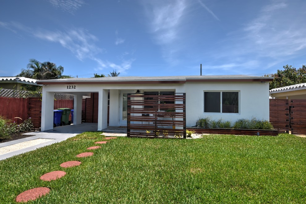Design ideas for a medium sized and white midcentury bungalow concrete detached house in Miami with a lean-to roof and a shingle roof.